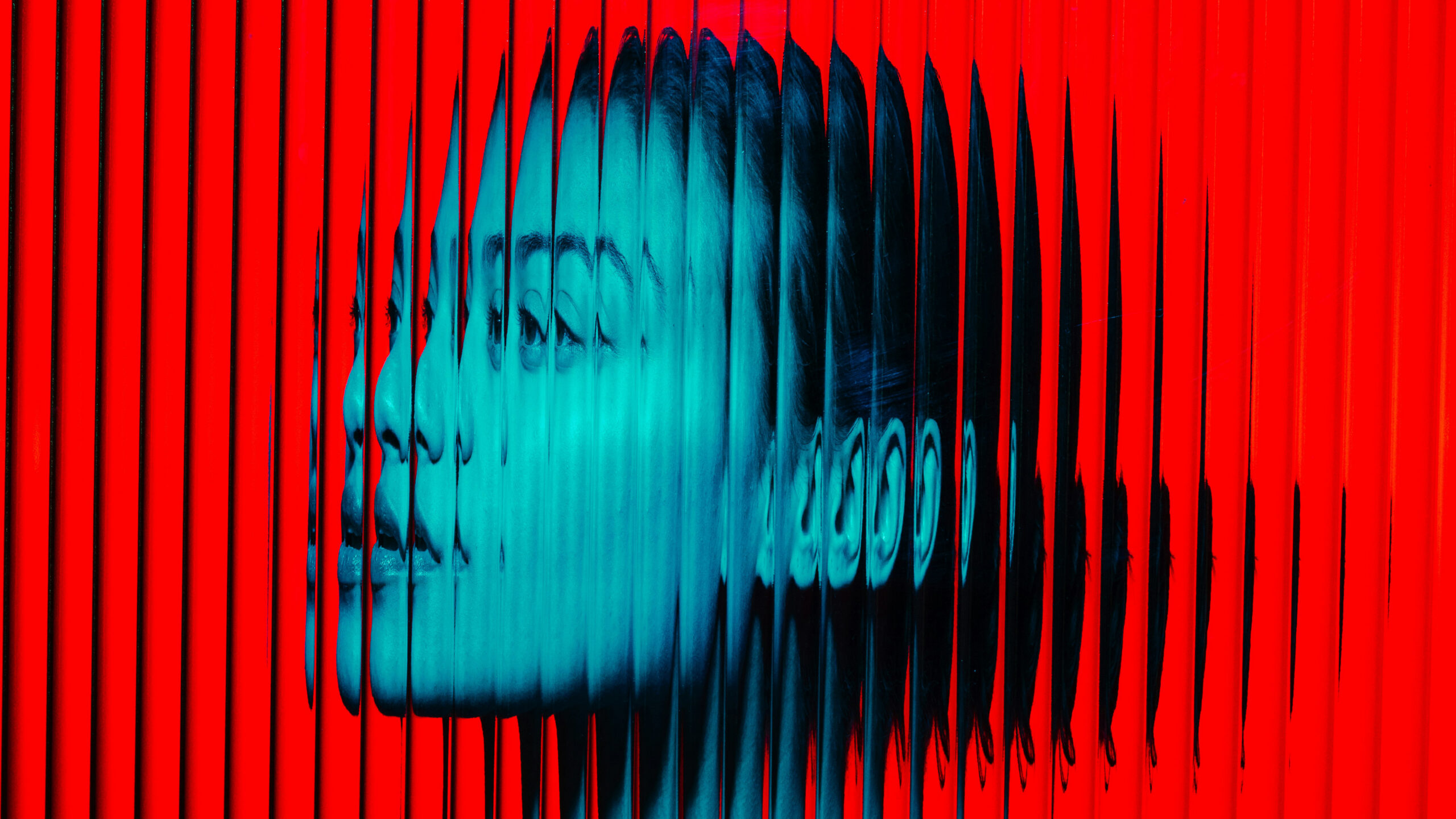 Distorted red and cyan portrait graphic representing AI-altered human identity